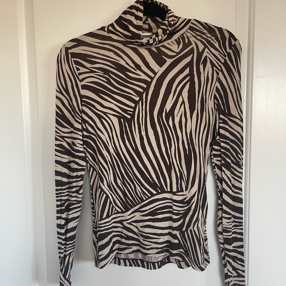 Great animal print turtle neck top-stretchy and comfy.